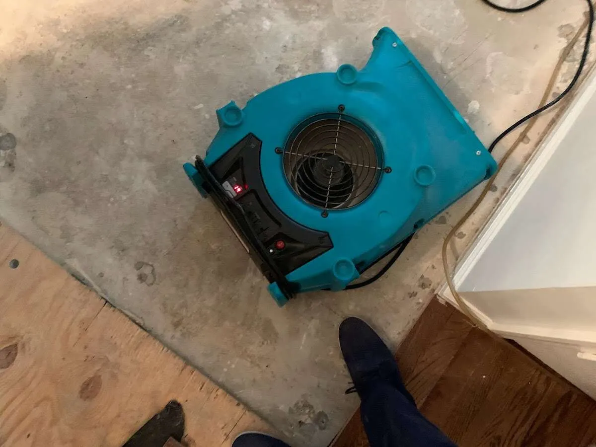 Air mover drying subfloor during Leak Detection & Repair in Warren